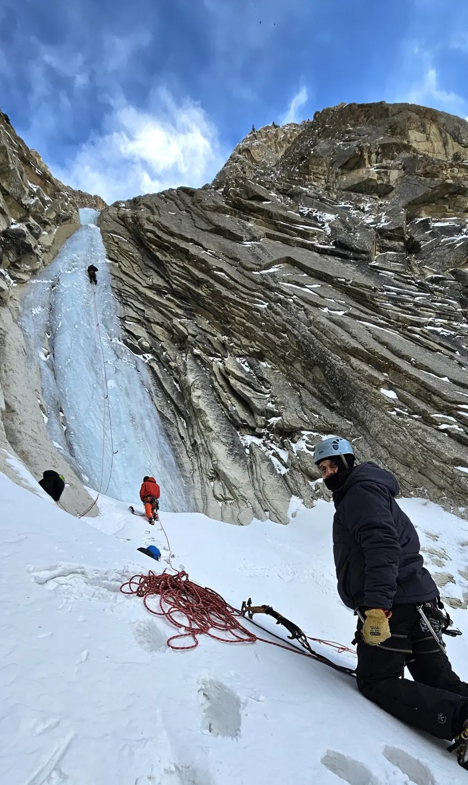 Ice climbers on a tall frozen waterfall in the Hushe valley, Karakoram