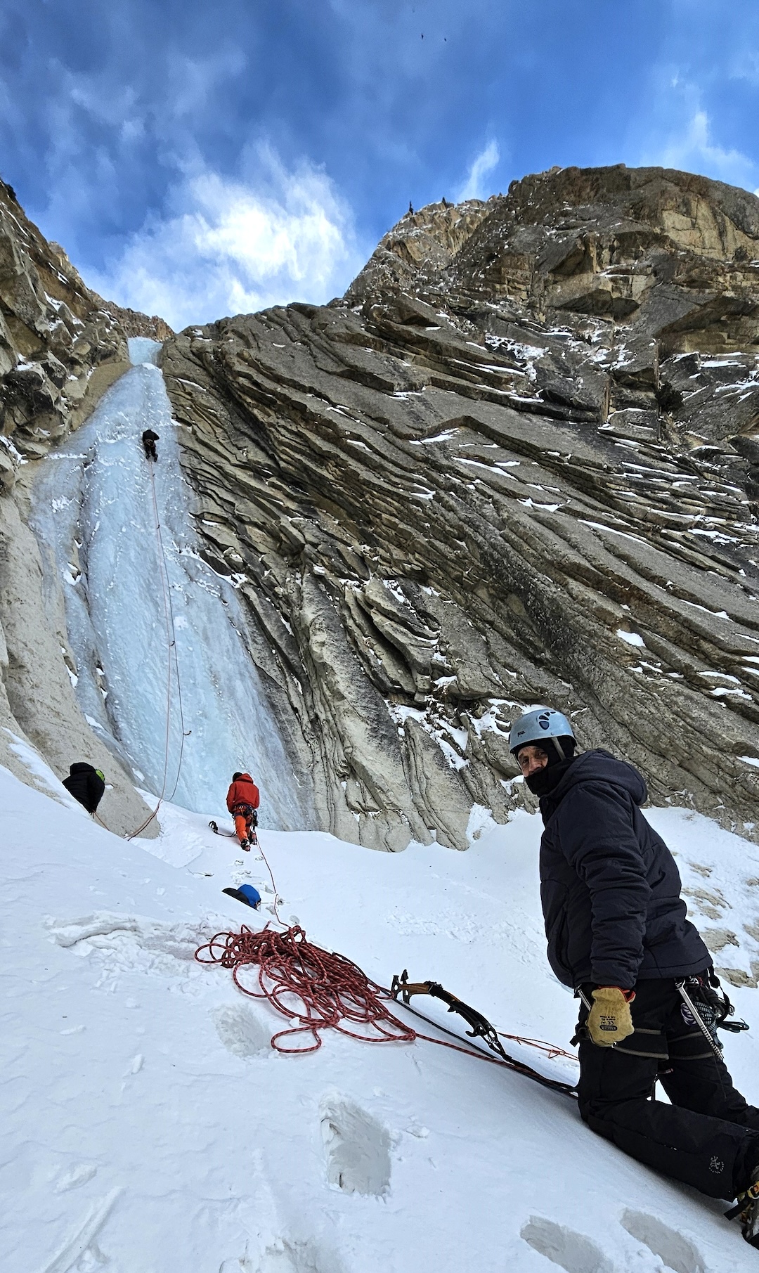 Ice climbers on a tall frozen waterfall in the Hushe valley, Karakoram