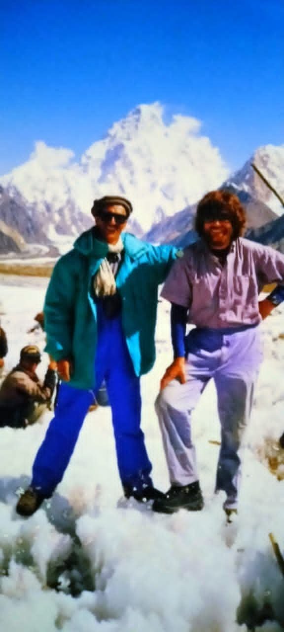 Rozi Ali and Reinhold Messner at K2 Base Camp, with K2 behind
