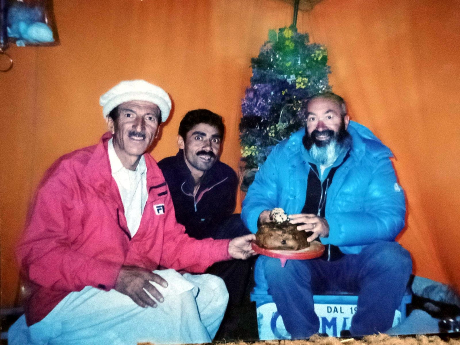 Rozi Ali celebrating with expedition members in a Base Camp tent
