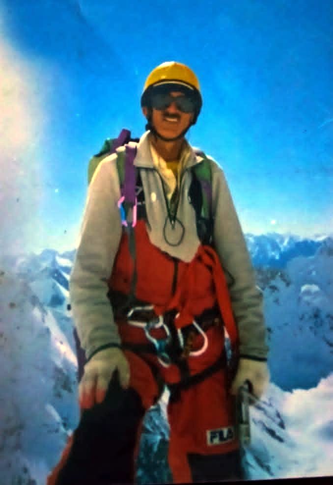 Rozi Ali climbing on a snow ridge in the Karakoram