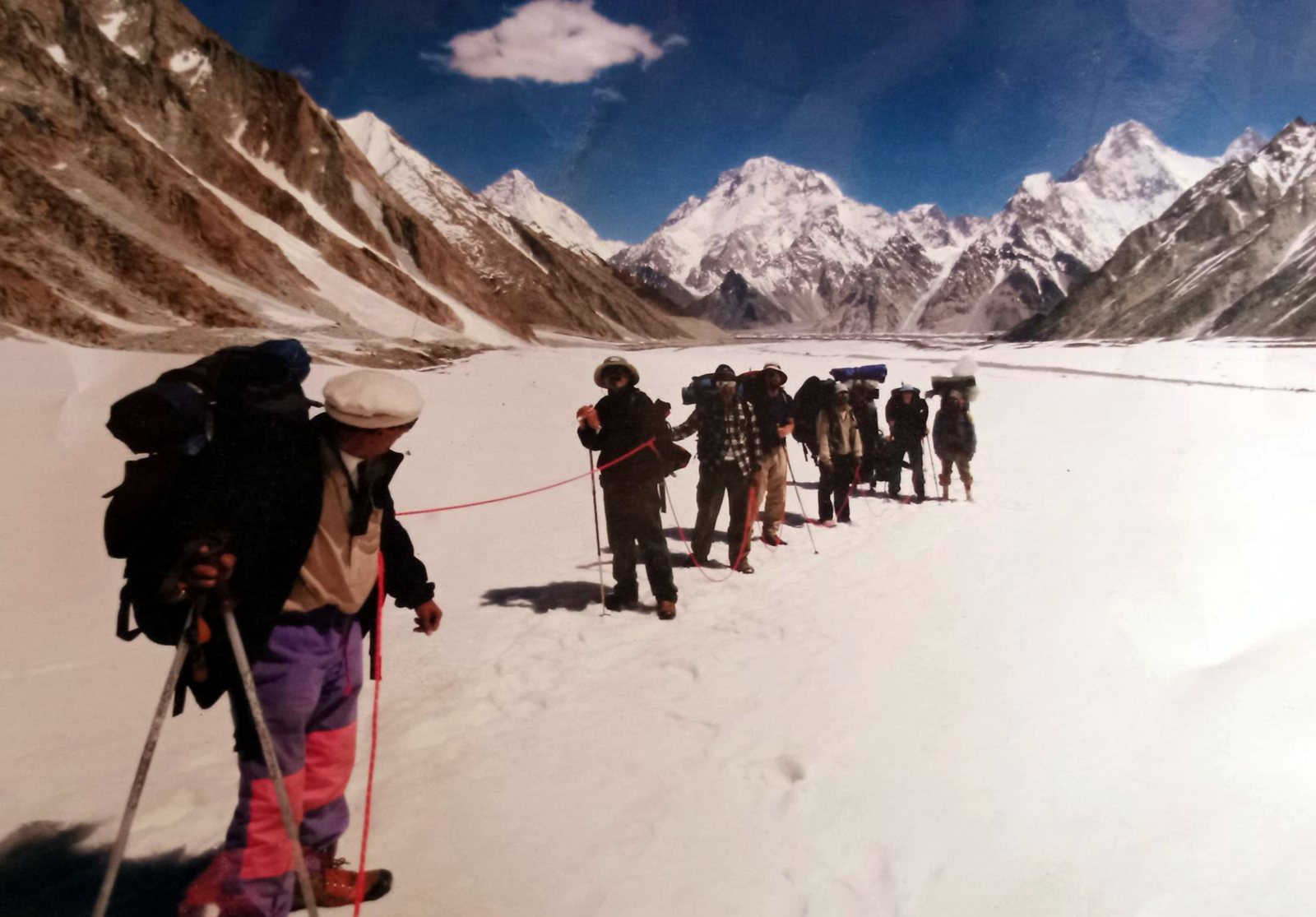 Rozi Ali leading a roped trekking group on the upper Baltoro Glacier